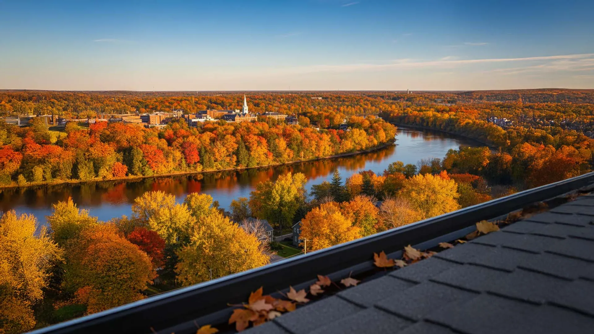 a view of Fredericton in fall with a leafy gutter